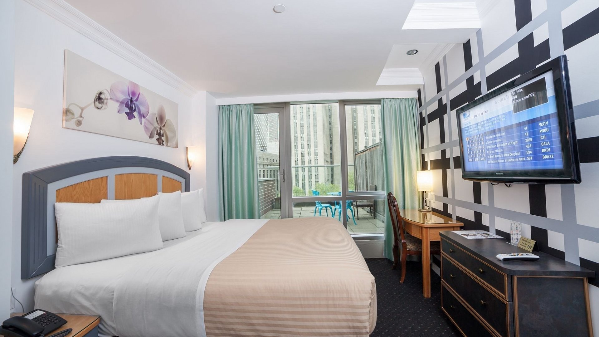 Photo  of Deluxe King Room with Balcony with a view of the lower west side, and all the standard amenities.